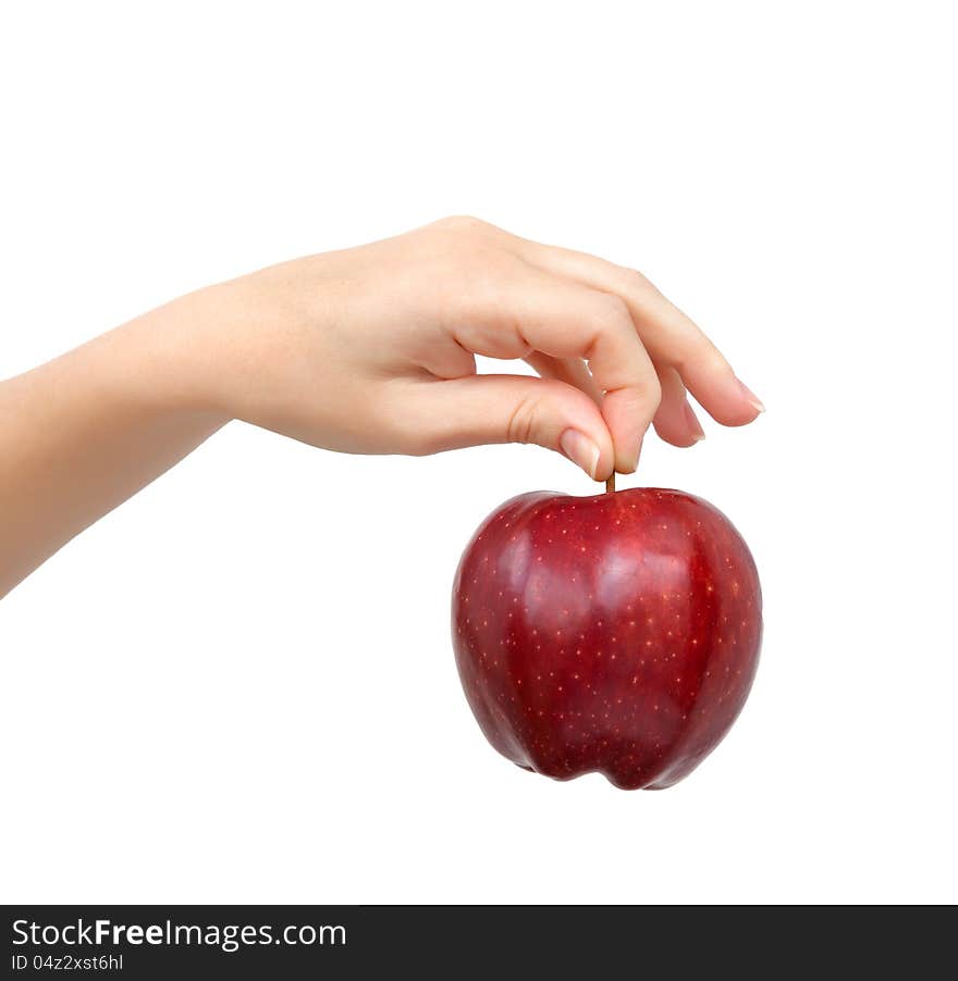 Woman hand on isolated background holding a red apple. Woman hand on isolated background holding a red apple