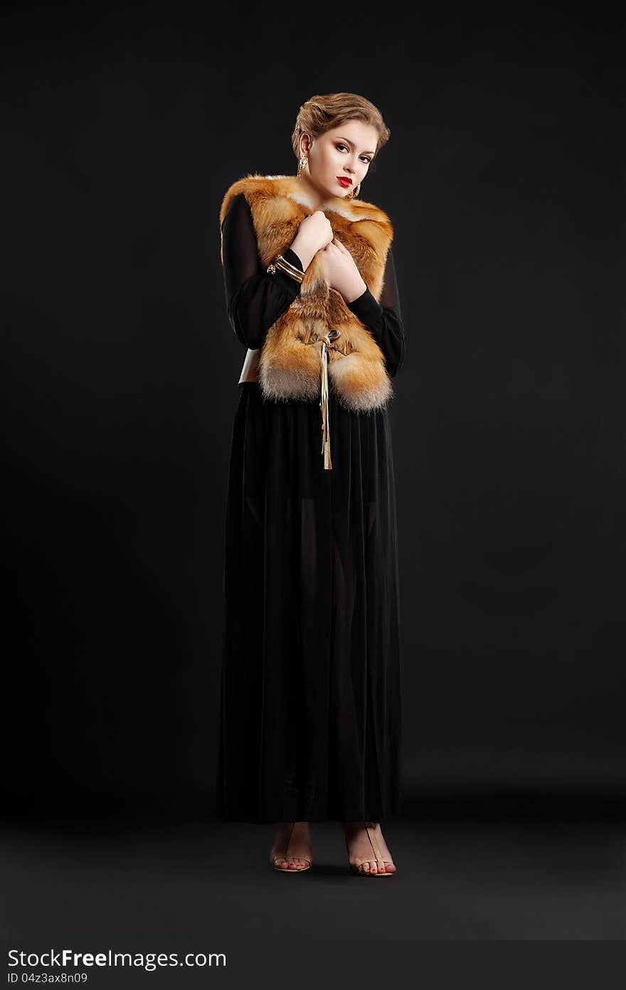 Woman in Black dress and Fox Fur Mantle - Glamour