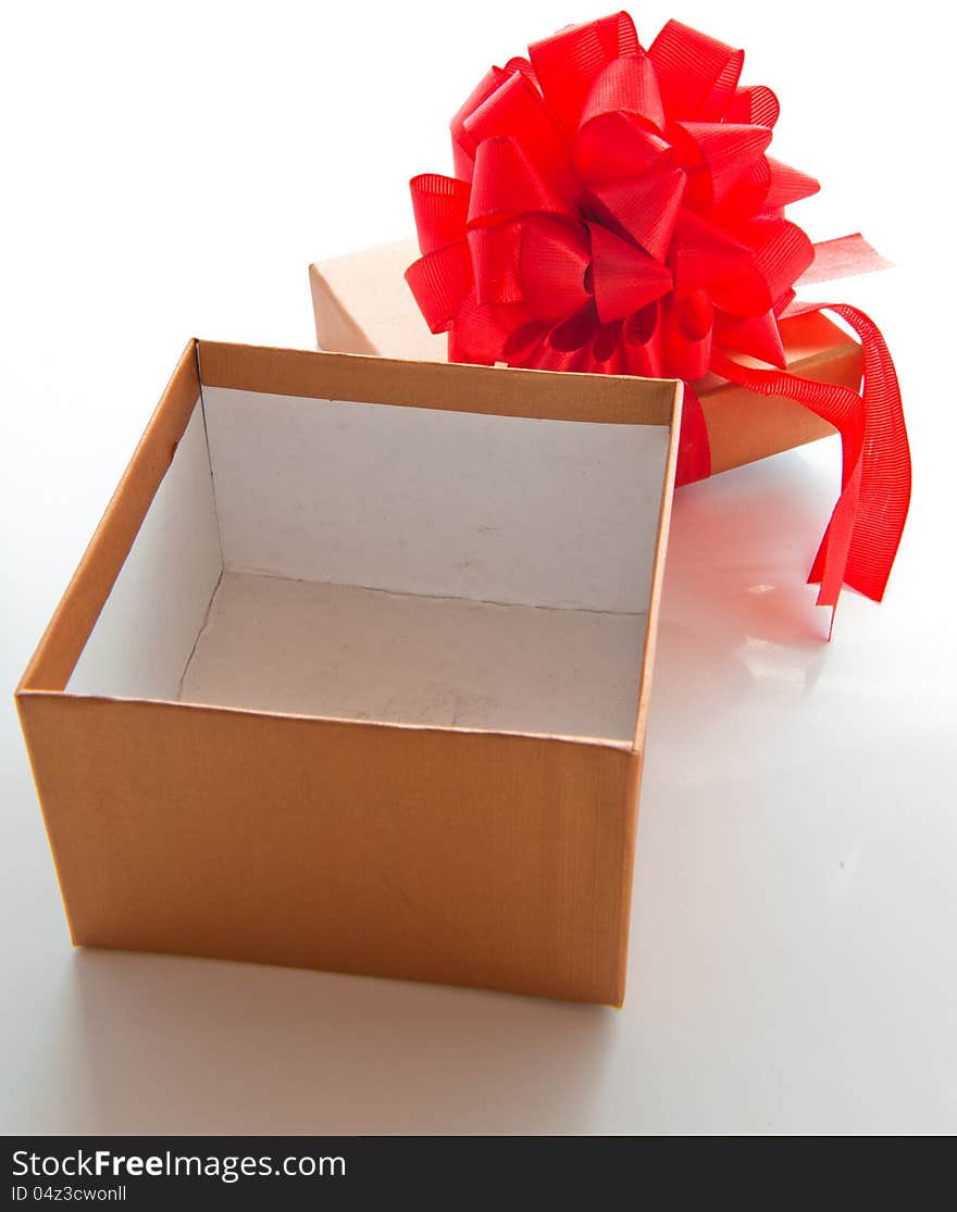 Gift box with red bow for Christmas or Valentine's day