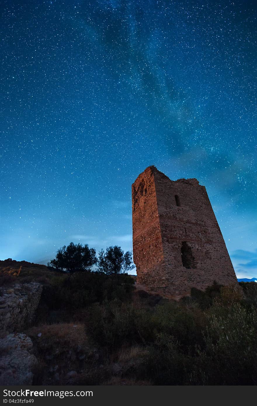 An amazing view of the milky way in front of the ruins of a medieval tower. An amazing view of the milky way in front of the ruins of a medieval tower