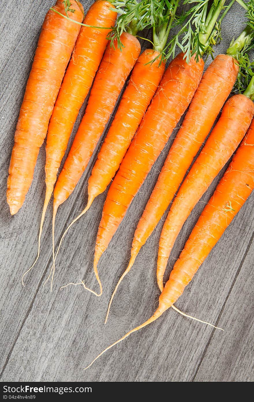 Biological carrots lying in row