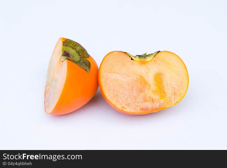 Persimmon fruit cut one side front in white background