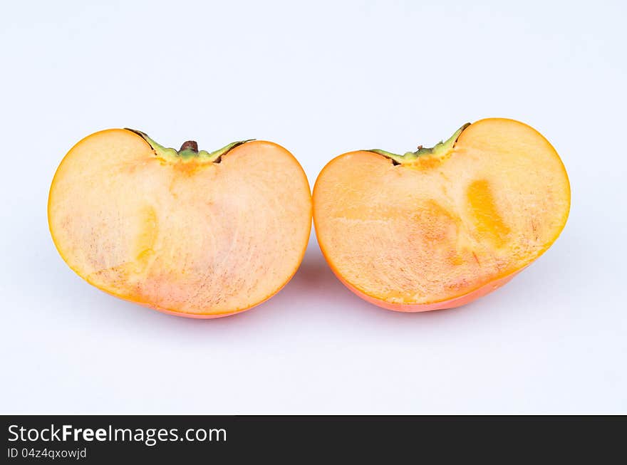 Persimmon fruit cut two side section in white background