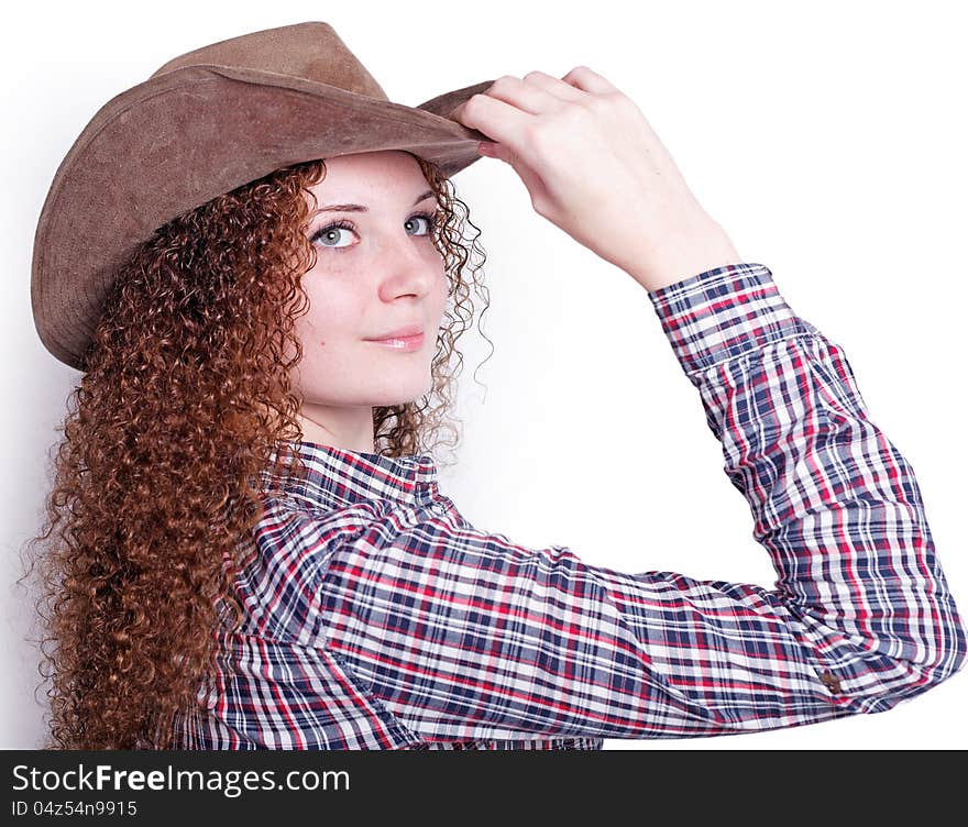 Portrait of pretty girl in a cowboy hat