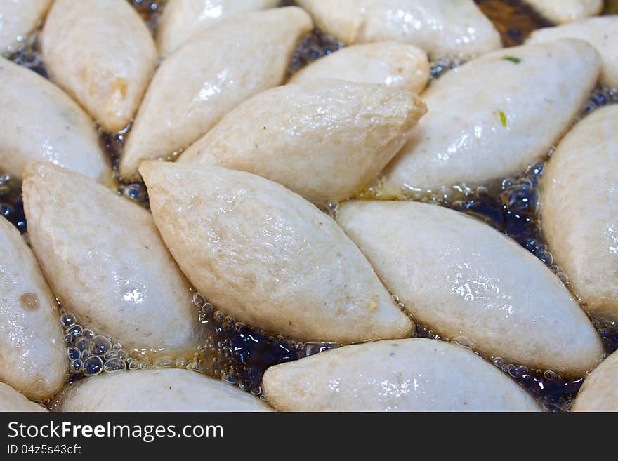 Fish ball fried on the boil oil. Fish ball fried on the boil oil