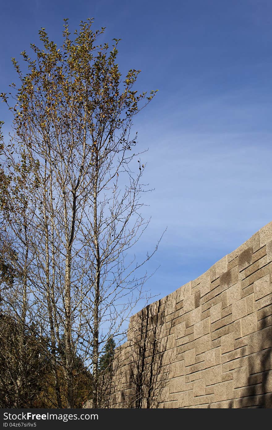 Large cement wall made of blocks at a construction site. Large cement wall made of blocks at a construction site.