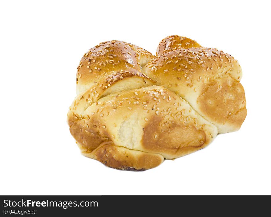 Sweet loaf of bread (challah) isolated on white background