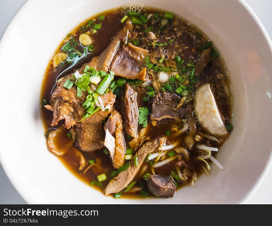 Asian cuisine, bowl of rice noodles with stewed duck