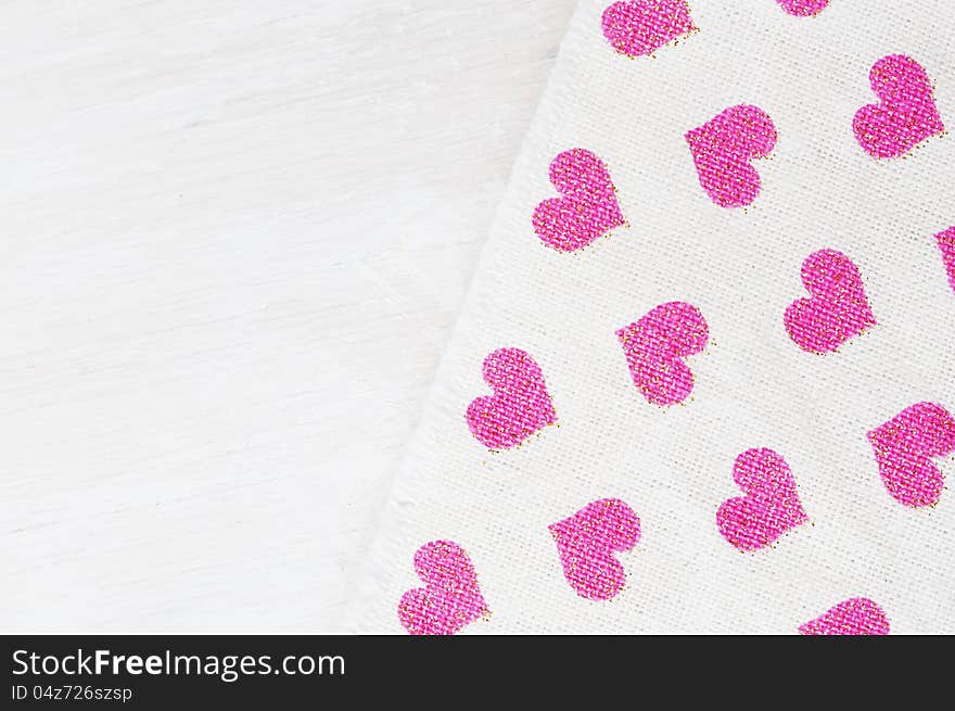 Valentines day background with pink heart shaped textile