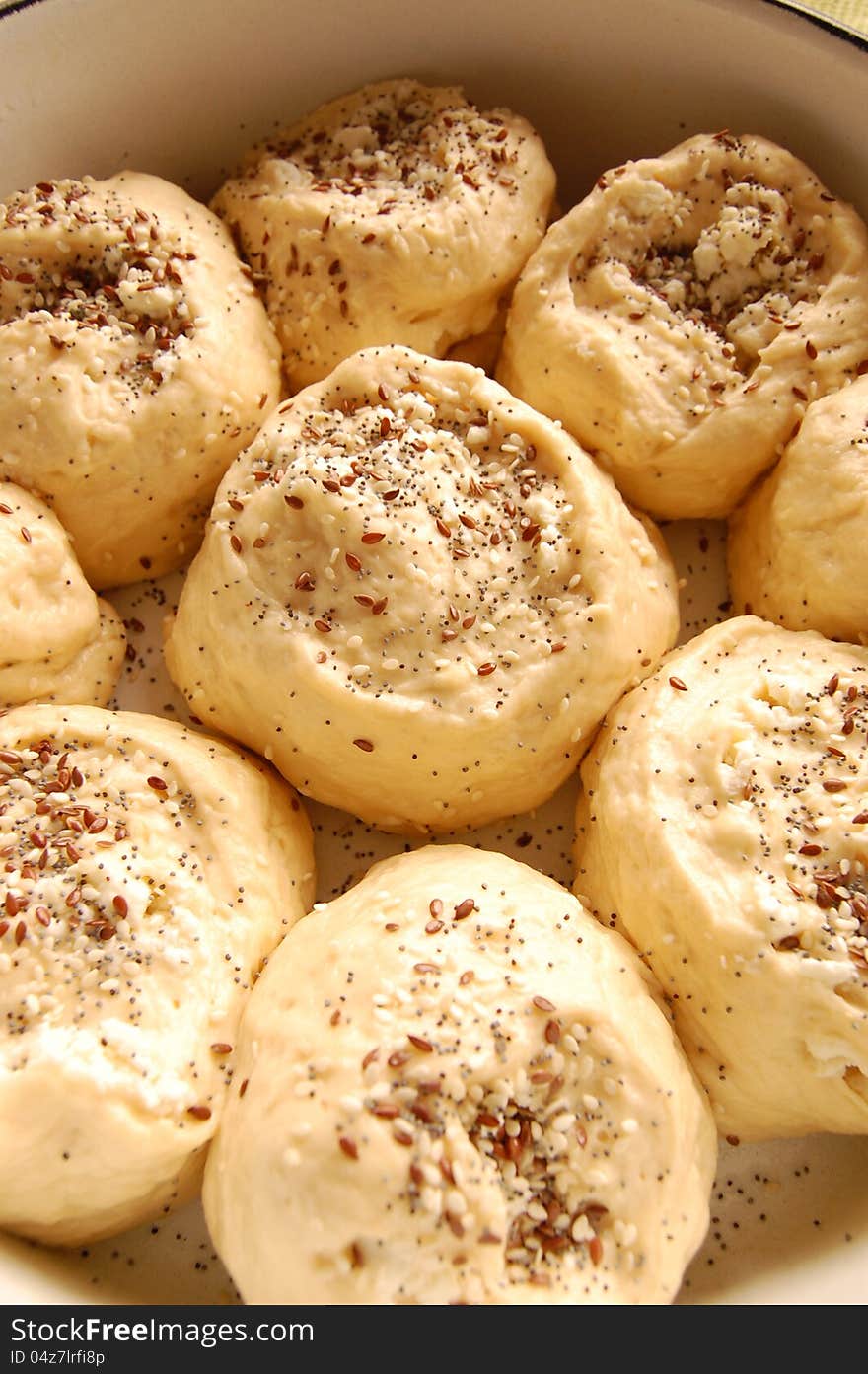 Raw griddle cakes with poppy and sesame seeds