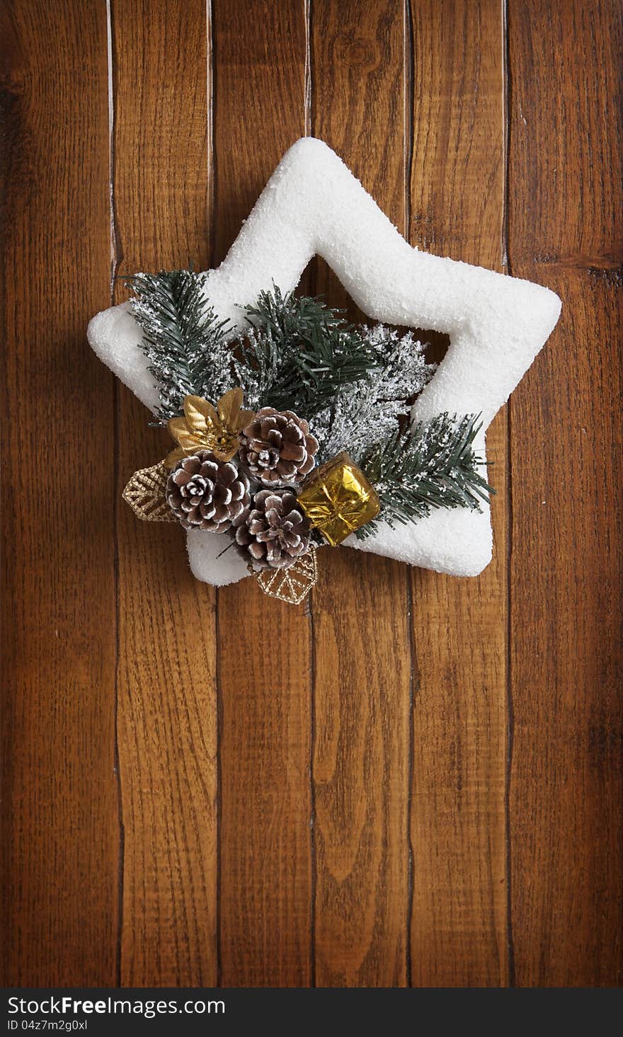 Christmas wreath on the background of wooden wall