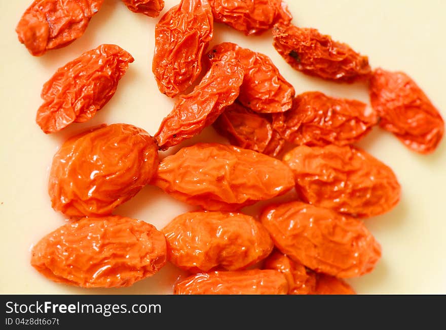 Dried Golgi Berry or Chinese Wolfberry (Lycium chinense) and some immersed in the water. Dried Golgi Berry or Chinese Wolfberry (Lycium chinense) and some immersed in the water.