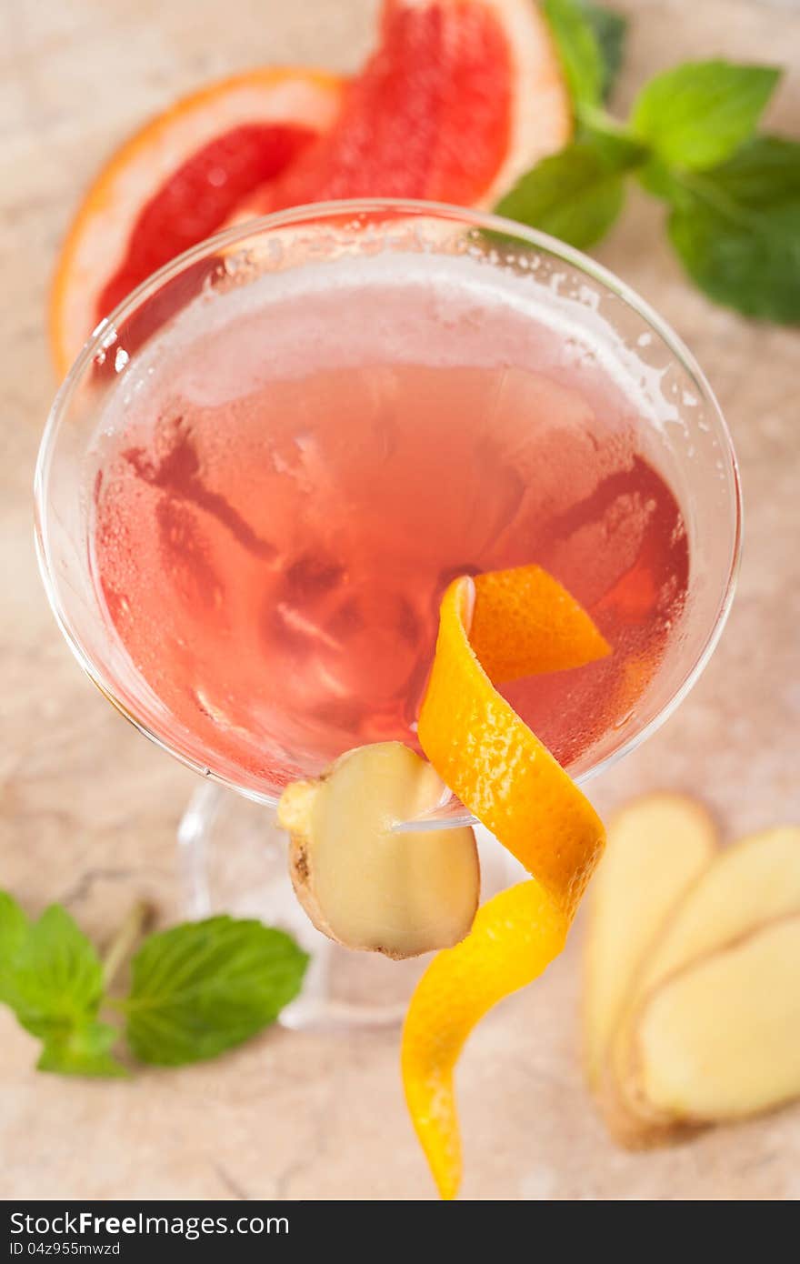 Red drink with ginger and cranberries, top view