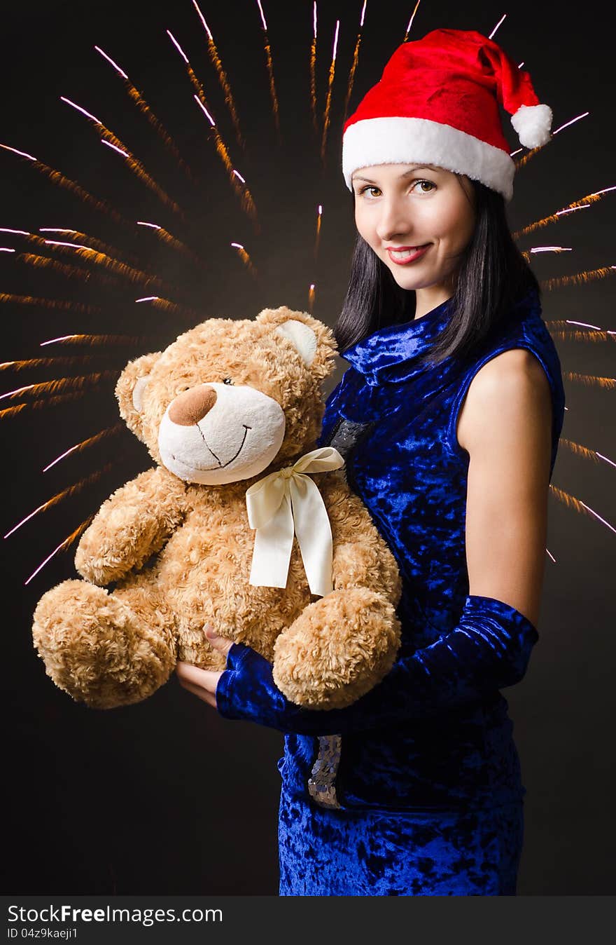 Snow maiden presents a toy bear in a gift