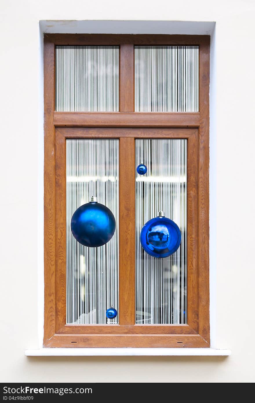 Fur-tree spheres in holiday window xmas background. Fur-tree spheres in holiday window xmas background