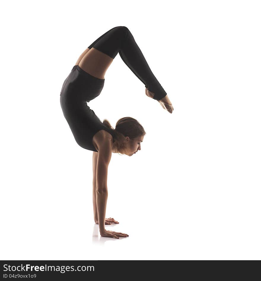 Studio shoot of cute woman gymnast isolated on white background. Studio shoot of cute woman gymnast isolated on white background