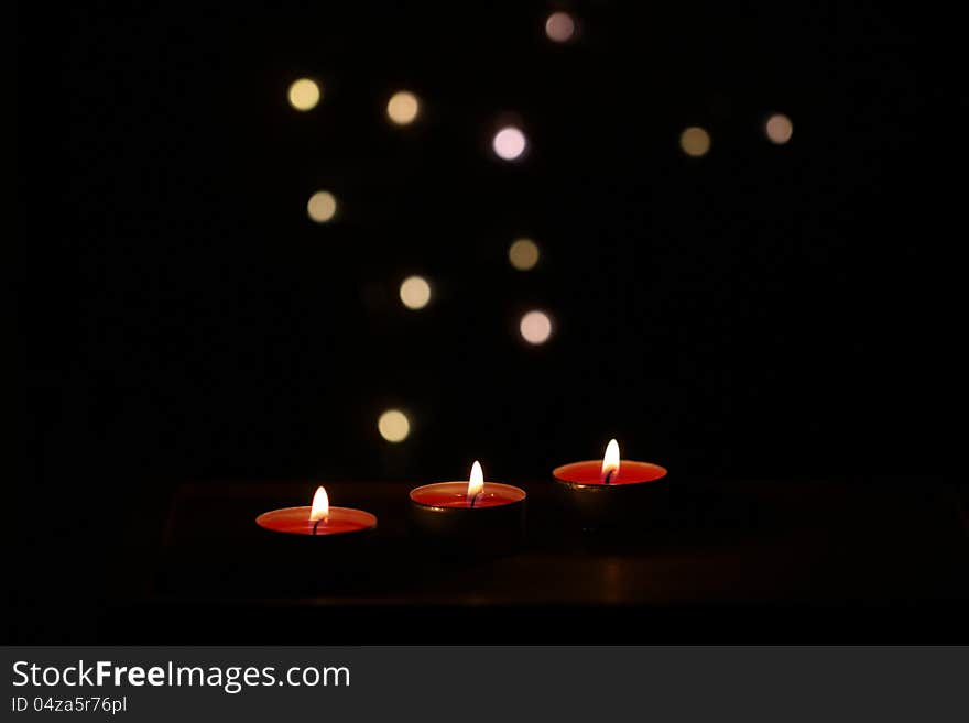 Red Christmas candles on dark background. Red Christmas candles on dark background