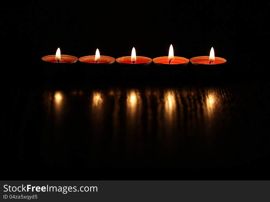 Red Christmas candles on dark background. Red Christmas candles on dark background