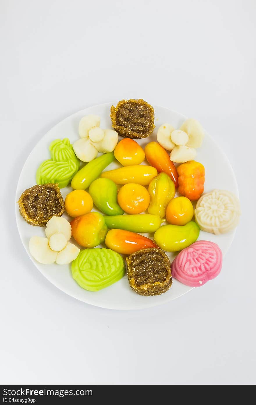 Various colorful Thai dessert on white plate