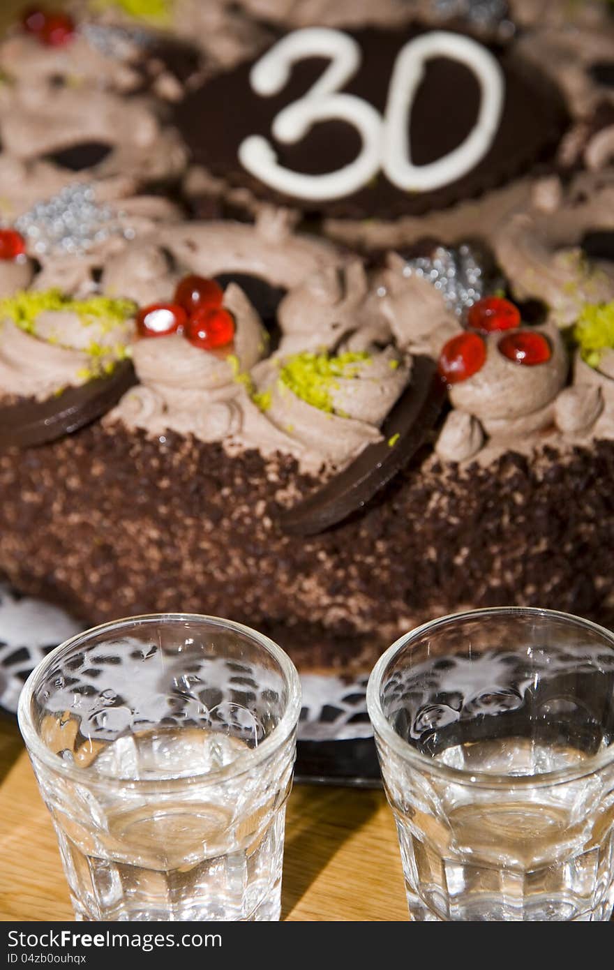 Birthday cake with glasses for a toast. Birthday cake with glasses for a toast