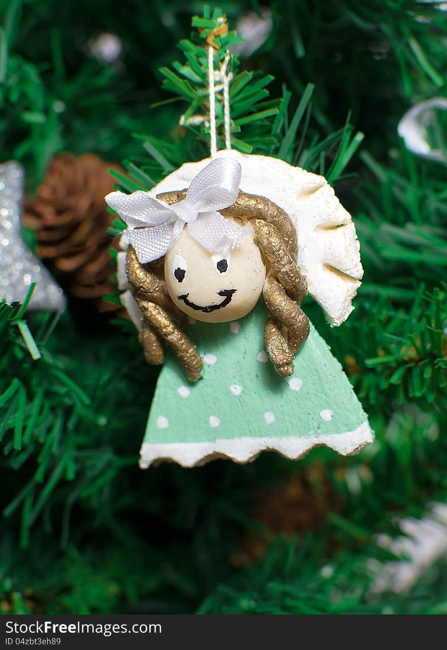 Funny decorative angel on xmas tree