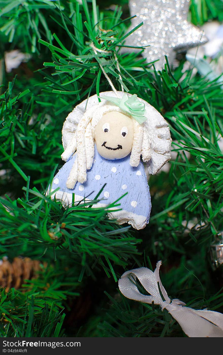 Funny decorative angel on xmas tree