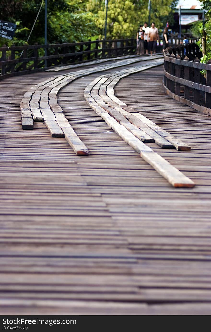 A walkway made by several wood planks. A walkway made by several wood planks