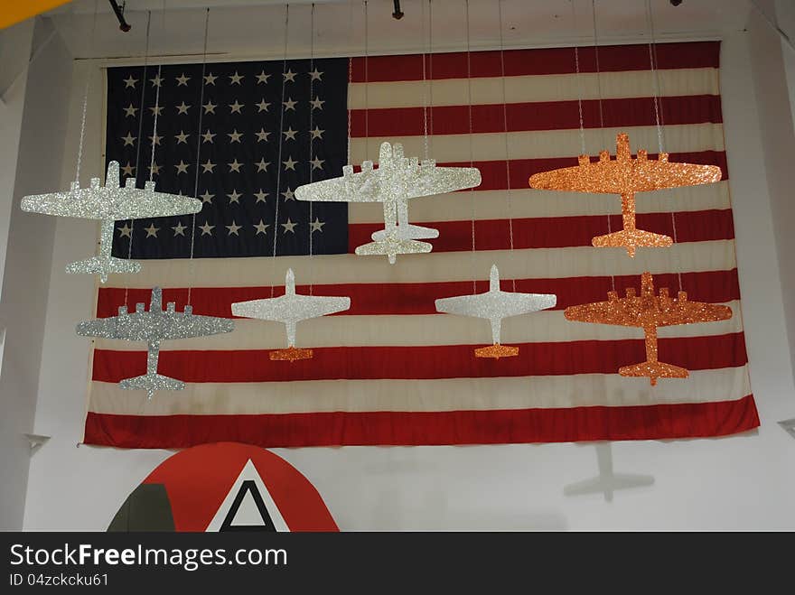 Vintage, historic, WW2 aircraft hanging from warehouse ceiling. Museum.