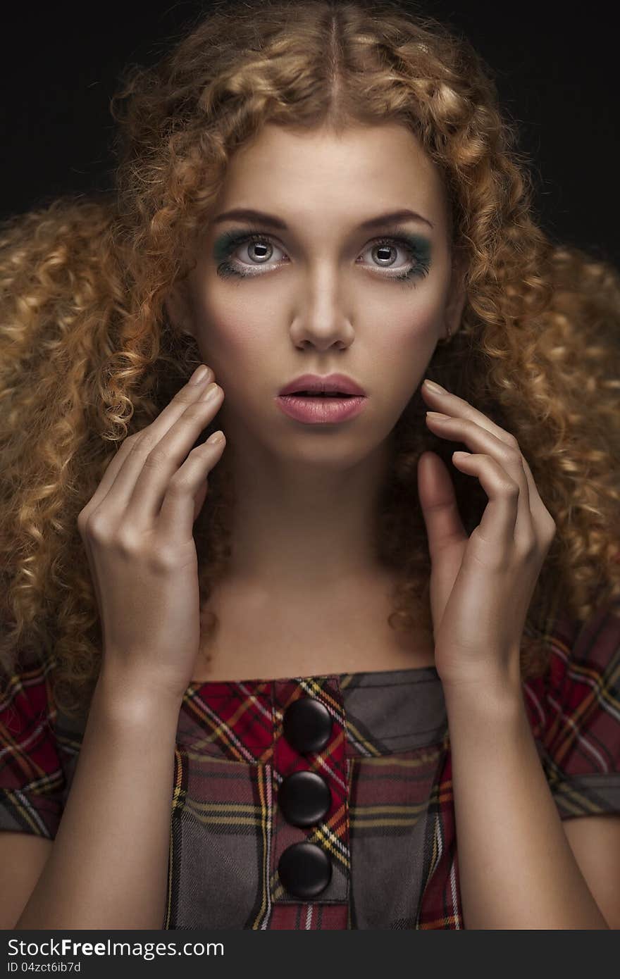 Portrait of young beautiful girl with curly red hair. Portrait of young beautiful girl with curly red hair