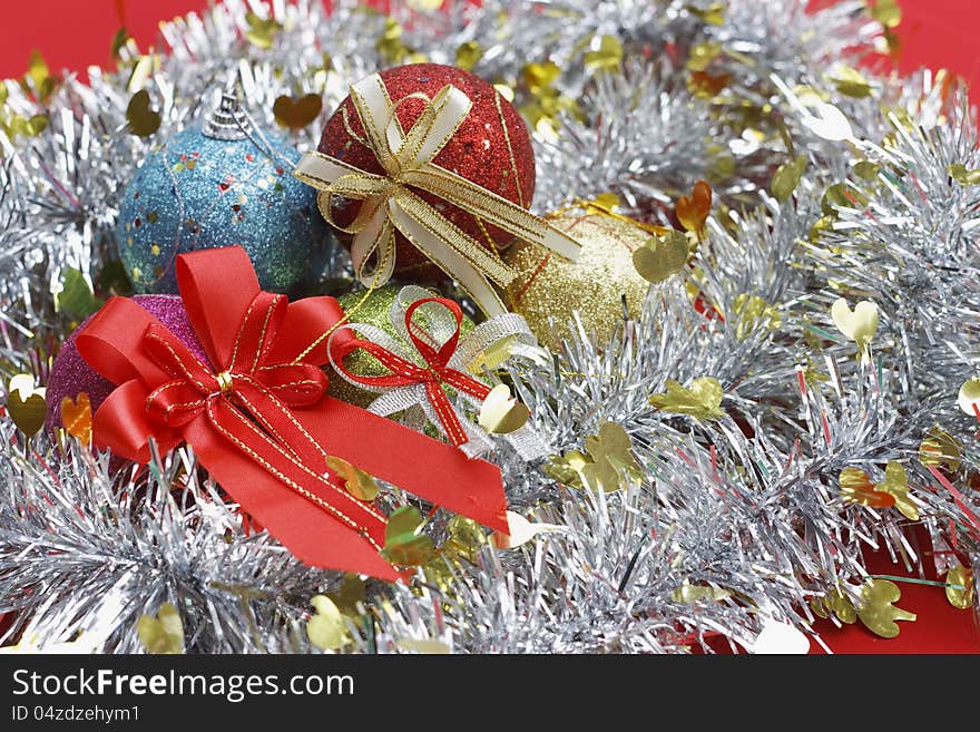 The red ribbon and fancy balls with party set for celebration. The red ribbon and fancy balls with party set for celebration