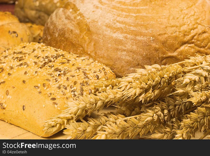 Bread, whole wheat bread and ears of wheat. Bread, whole wheat bread and ears of wheat.