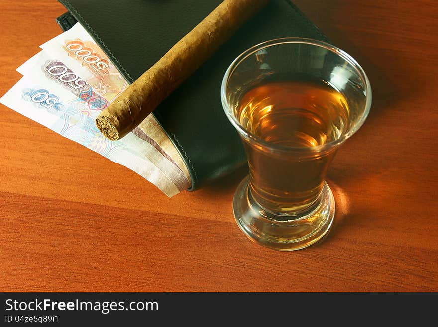 Alcohol, money and a cigar