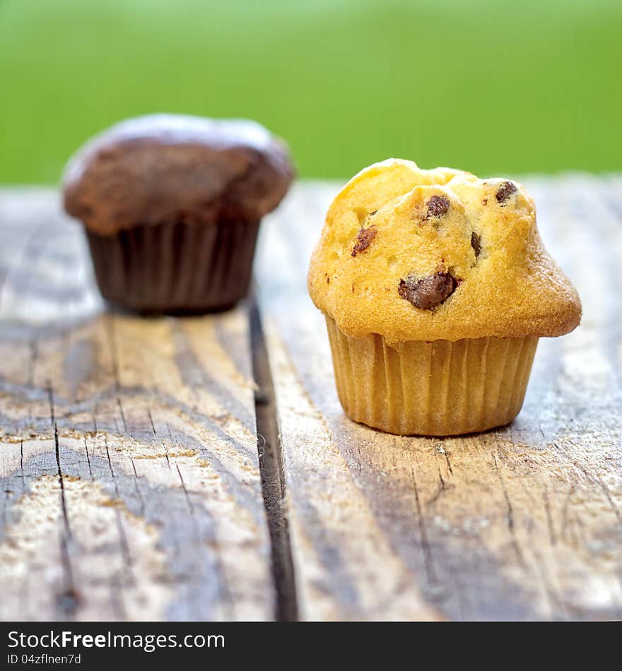 Chocolate chip muffin on old wooden table. Chocolate chip muffin on old wooden table