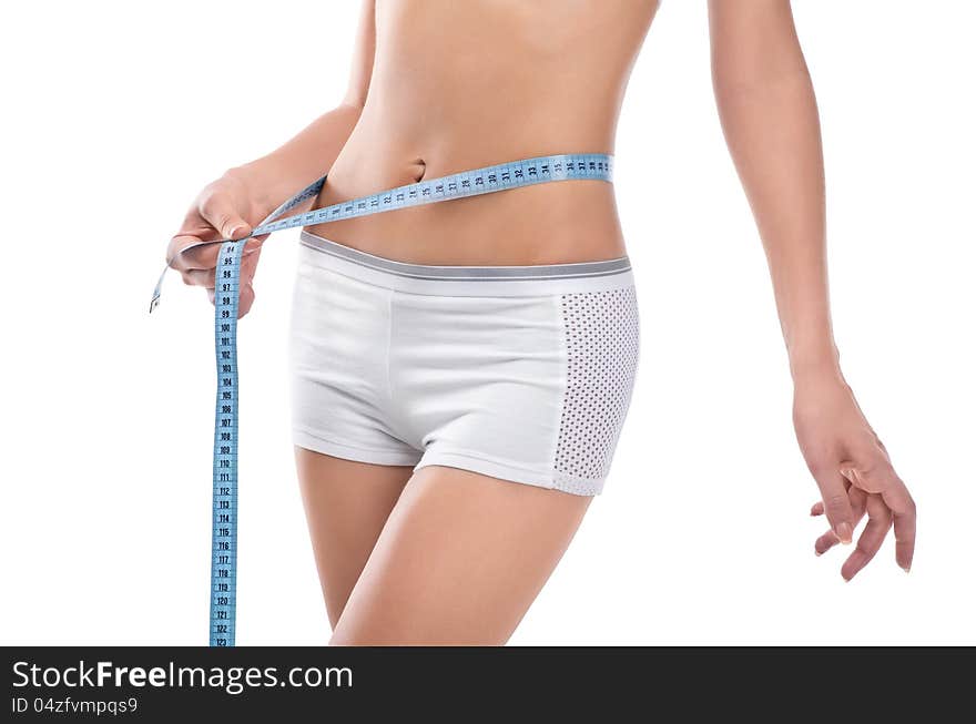 Woman measuring waist of perfect body by centimeter