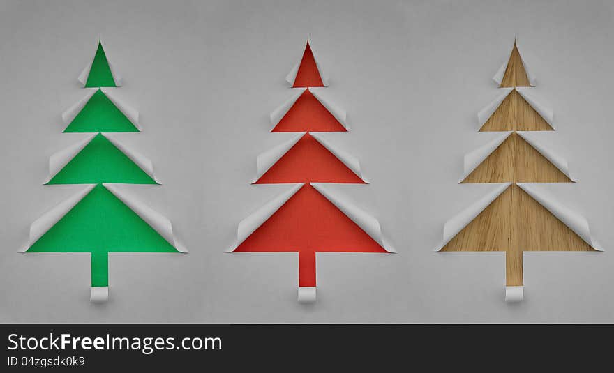 Three Christmas trees made of paper for design