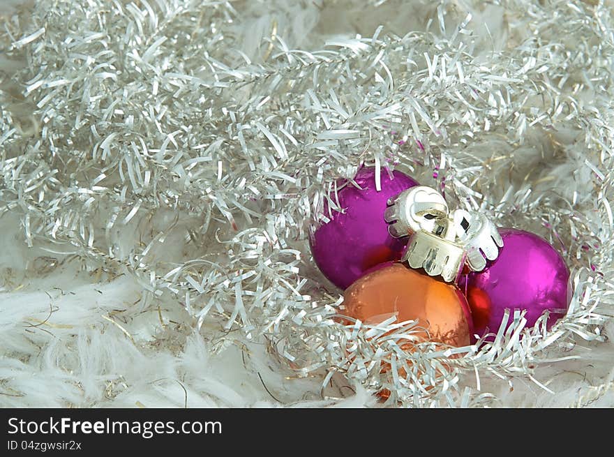 Three Christmas ornaments on a Christmas tree. Three Christmas ornaments on a Christmas tree