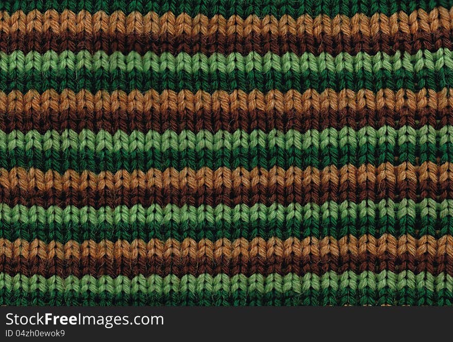 Texture: knitted fabric knitting large with colored horizontal stripes. Texture: knitted fabric knitting large with colored horizontal stripes