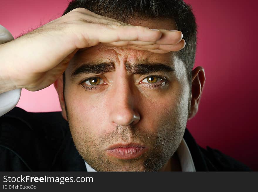 Close up studio portrait of a serious man looking at the background