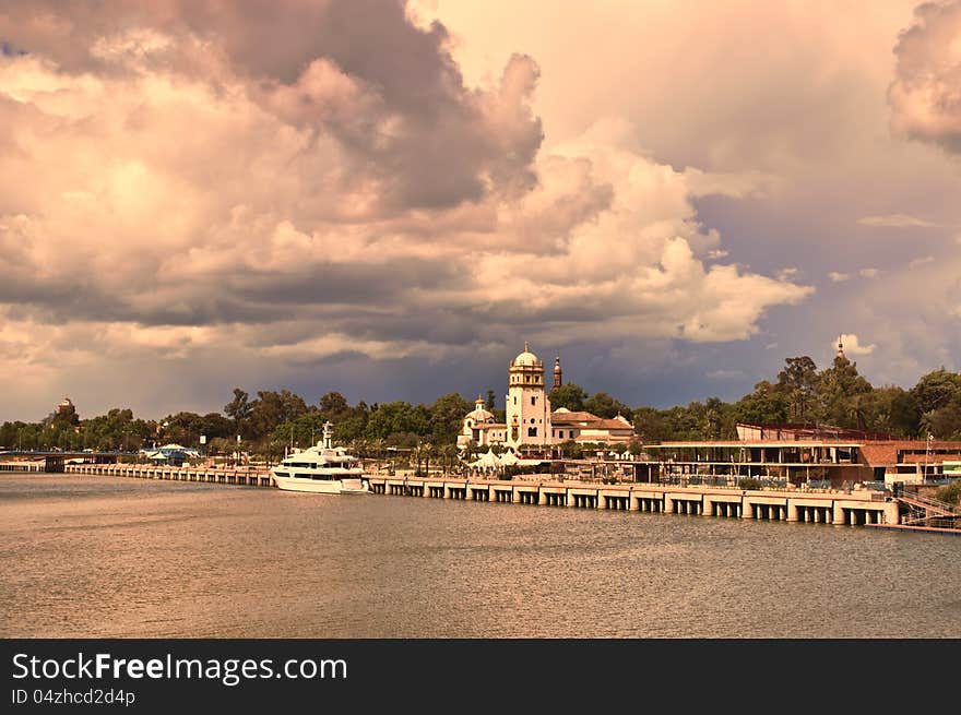 Guadalquivir river with cloudy sky as background. Guadalquivir river with cloudy sky as background