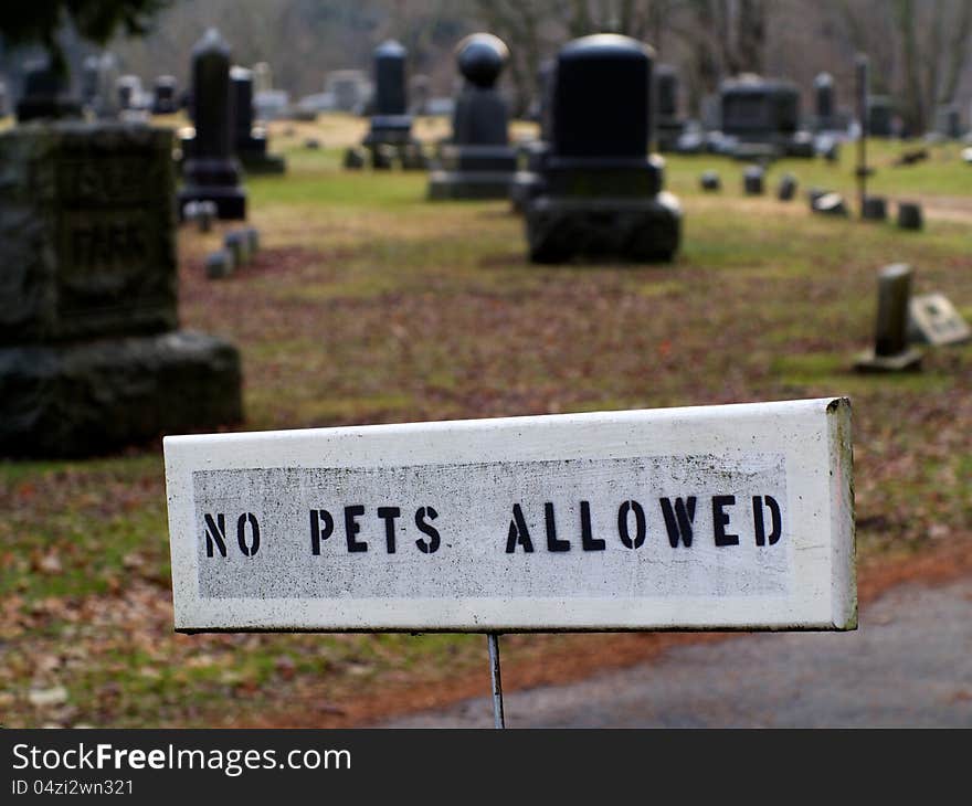 No pets allowed sign is shown at entrace to cemetery. No pets allowed sign is shown at entrace to cemetery.