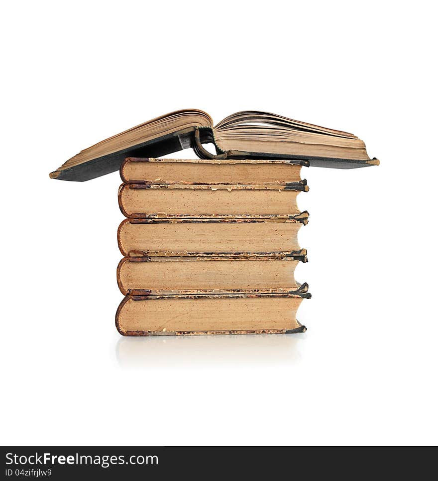 Stack of old books on white background. Clipping path is included. Stack of old books on white background. Clipping path is included