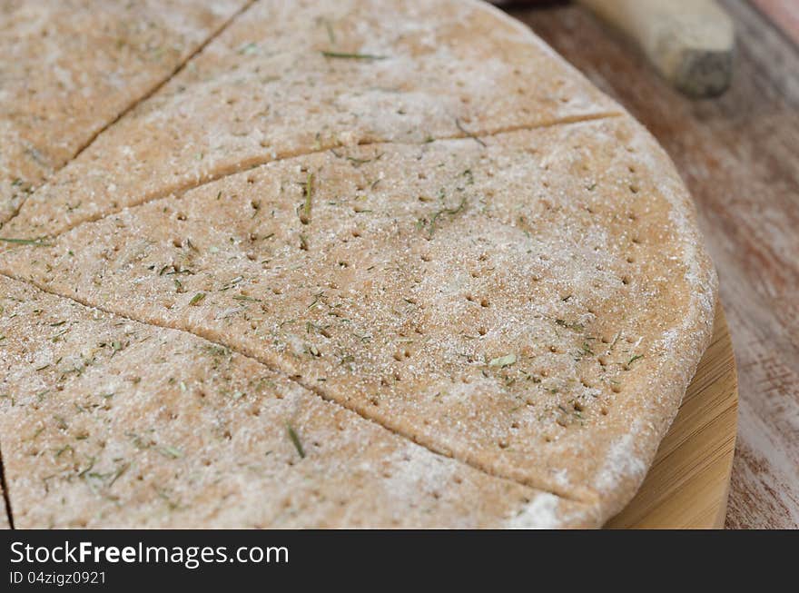 Cut portions flat bread made ​​from rye flour with dill. Cut portions flat bread made ​​from rye flour with dill