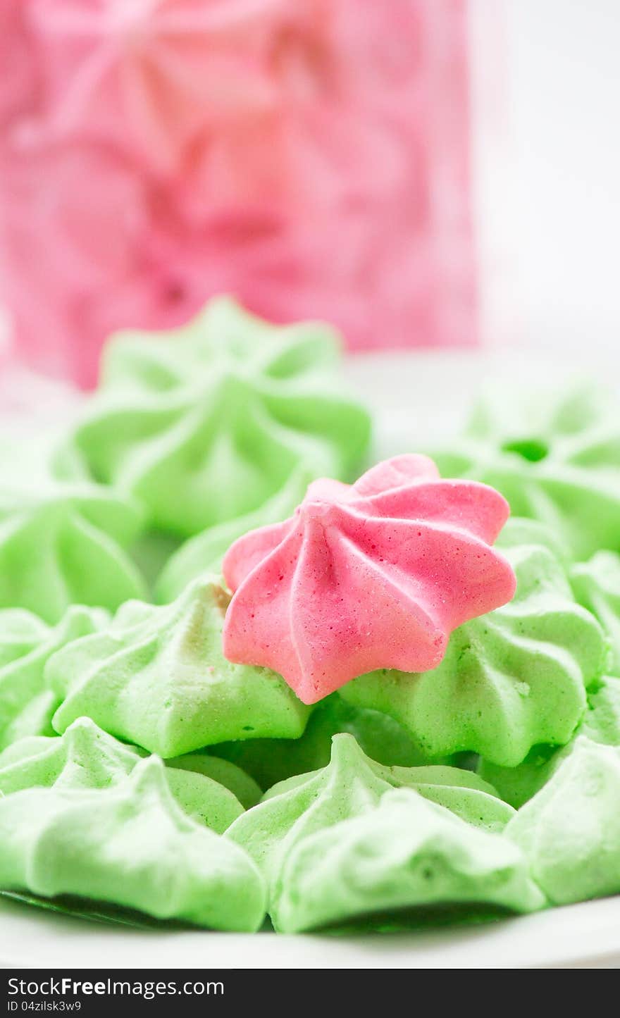 Close-up of pink and green Meringue cookies