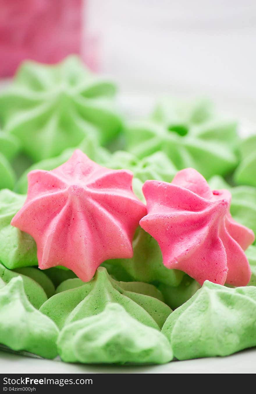 Close-up of pink and green Meringue cookies