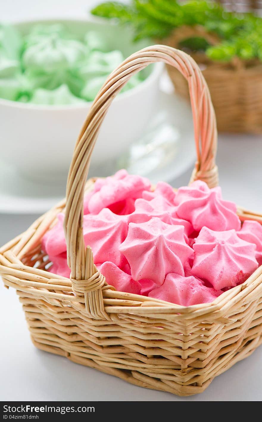 Pink Meringue cookies in basket