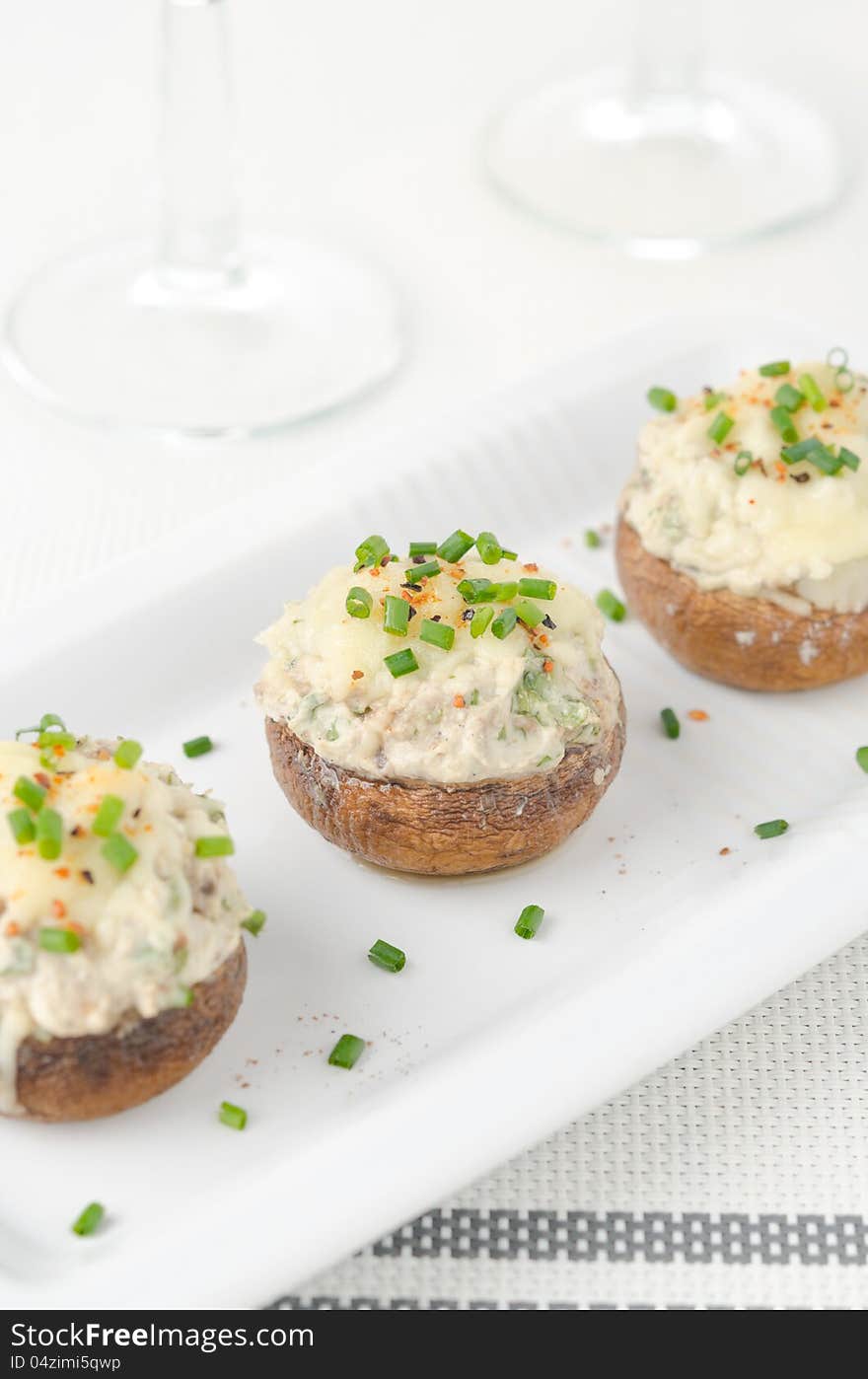 Stuffed mushrooms, baked with cheese and herbs, selective focus