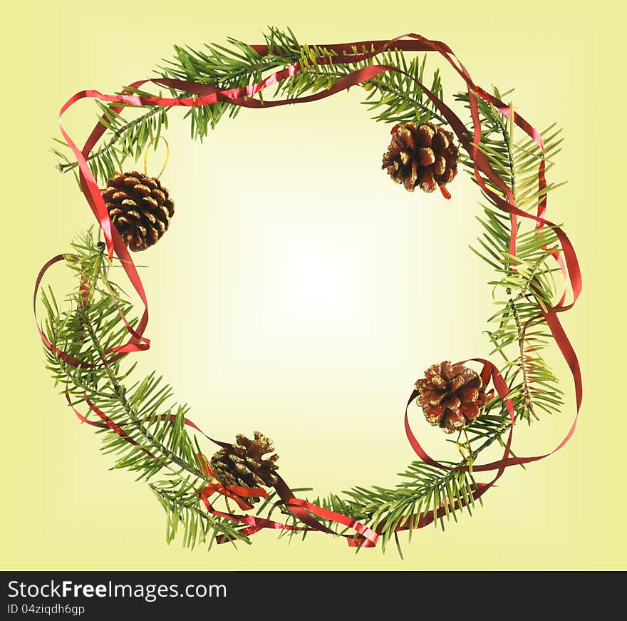 The christmas border with cones, ribbon and conifer branch