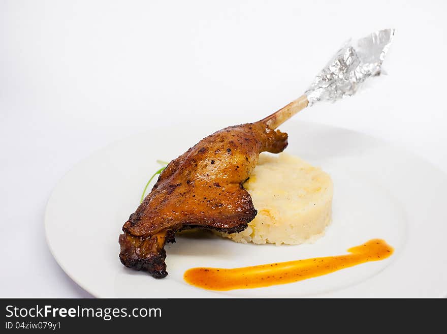 Roasted goose leg in close up. Roasted goose leg in close up