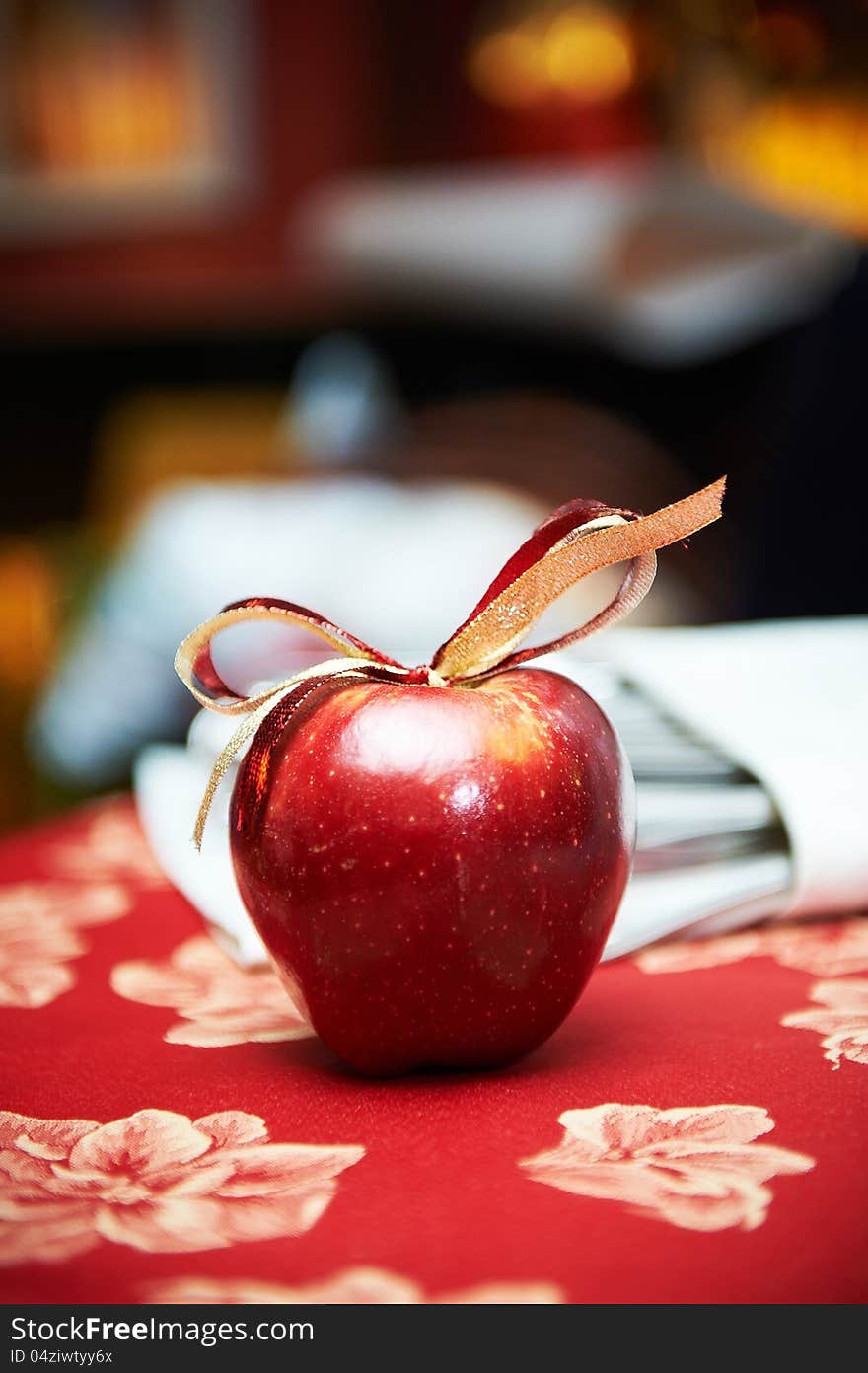 Red apple with bow