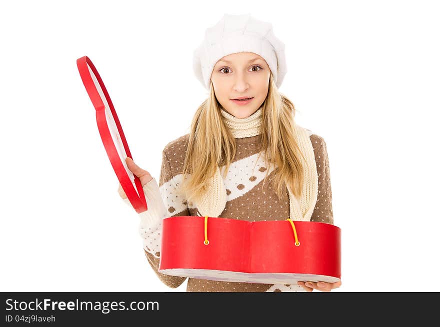 Girl in winter hat with a gift. Girl in winter hat with a gift